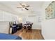 Comfortable bedroom featuring a ceiling fan, hardwood floors, and an efficient air conditioning unit at 1004 E 22Nd Ave, Tampa, FL 33605