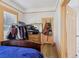 Bedroom with organized clothes rack, dresser, and closet that maximizes storage space at 1004 E 22Nd Ave, Tampa, FL 33605