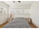 Comfortable bedroom featuring wood floors, a ceiling fan, and plenty of natural light at 1004 E 22Nd Ave, Tampa, FL 33605