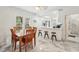 Open concept dining area with marble floors, a dining table set, and a breakfast bar for flexible seating at 1004 E 22Nd Ave, Tampa, FL 33605