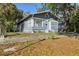 Inviting blue house with tidy lawn and neighborhood views at 1004 E 22Nd Ave, Tampa, FL 33605