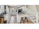 Modern kitchen with stainless steel microwave and island with seating near the stairs at 1004 E 22Nd Ave, Tampa, FL 33605