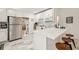 Bright kitchen features stainless steel appliances, white cabinets, and an island with bar stool seating at 1004 E 22Nd Ave, Tampa, FL 33605