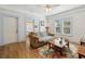 Cozy living room with hardwood floors, a comfortable sofa, and natural light at 1004 E 22Nd Ave, Tampa, FL 33605