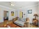 Charming living room with hardwood flooring, a comfy couch, and soft lighting for a welcoming atmosphere at 1004 E 22Nd Ave, Tampa, FL 33605