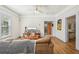 Cozy living room with hardwood floors, a comfortable sofa, and a view into other rooms at 1004 E 22Nd Ave, Tampa, FL 33605
