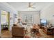 Comfortable living room features hardwood floors, neutral paint colors and cozy furniture at 1004 E 22Nd Ave, Tampa, FL 33605