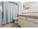 Bathroom with neutral-colored tile, updated vanity, and a shower/tub combo at 11700 Park Blvd # 202, Seminole, FL 33772