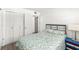 Clean bedroom featuring a bed and closet, accompanied by sleek, neutral walls and wood-look floors at 11700 Park Blvd # 202, Seminole, FL 33772