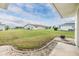Expansive backyard view with well-maintained lawn and landscaping, perfect for outdoor activities and relaxation at 1515 Danbury Dr, Sun City Center, FL 33573