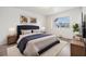 Stylish bedroom with a cozy bed, coordinated decor, and a bright window at 1515 Danbury Dr, Sun City Center, FL 33573