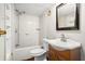 The bathroom includes a vanity with a sink and mirror, a toilet, and a shower at 15165 Waverly St, Clearwater, FL 33760