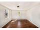 Bedroom with wood floors and natural light coming from two windows at 15165 Waverly St, Clearwater, FL 33760