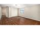 Bedroom with wood flooring, closet, and a large window at 15165 Waverly St, Clearwater, FL 33760