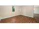 This bedroom has wood flooring and one window that lets in natural light at 15165 Waverly St, Clearwater, FL 33760