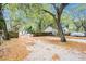 The exterior lot with mature trees, with room to park vehicles and recreational vehicles at 15165 Waverly St, Clearwater, FL 33760