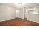 Bright living room with modern floors, flowing seamlessly into the updated kitchen at 15165 Waverly St, Clearwater, FL 33760
