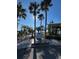 Beautiful boardwalk featuring a dolphin statue and stunning water views, offering a serene escape at 1567 Patton Dr, Dunedin, FL 34698