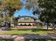 Outdoor park with a green lawn and a covered bandstand at 1567 Patton Dr, Dunedin, FL 34698