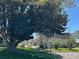 Charming community center surrounded by beautiful trees and lush landscaping at 1567 Patton Dr, Dunedin, FL 34698