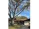 Charming single-story home featuring an attached garage and well-kept lawn at 1567 Patton Dr, Dunedin, FL 34698