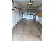 Spacious garage with washer and dryer, overhead storage racks, and built-in cabinets at 1567 Patton Dr, Dunedin, FL 34698