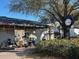 Quaint ice cream shop with outdoor seating, shaded by a beautiful tree, inviting customers to enjoy a sweet treat at 1567 Patton Dr, Dunedin, FL 34698