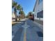 A picturesque path with palm trees leads to a vibrant, walkable downtown area at 1567 Patton Dr, Dunedin, FL 34698