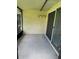 Screened-in patio with a concrete floor and a sliding glass door at 1567 Patton Dr, Dunedin, FL 34698