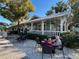 Outdoor seating at a restaurant in a scenic setting at 1567 Patton Dr, Dunedin, FL 34698