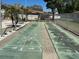 Community shuffleboard courts with seating nearby for active recreational enjoyment at 1567 Patton Dr, Dunedin, FL 34698