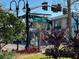 Picturesque street view with street signs, decorative lampposts, and a glimpse of local charm at 1567 Patton Dr, Dunedin, FL 34698