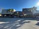 Lively street view with restaurants, bars, and retail shops, showcasing the area's vibrant commercial district at 1567 Patton Dr, Dunedin, FL 34698