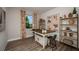Bright bedroom boasts wood floors, a large window with a view, and space for a custom workspace at 18604 Arbor Vista Dr, Venice, FL 34293