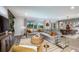 Spacious living room with large windows, comfortable seating, and modern decor at 18604 Arbor Vista Dr, Venice, FL 34293