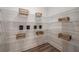Spacious pantry with ample shelving for organized storage of food items and household essentials at 18604 Arbor Vista Dr, Venice, FL 34293