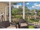 Cozy balcony seating area offers a relaxing outdoor space with neighborhood views at 2308 W Jetton Ave, Tampa, FL 33629