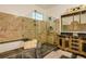 Luxurious bathroom with a glass shower, soaking tub, and designer vanity at 2308 W Jetton Ave, Tampa, FL 33629