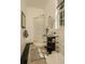 Bright bathroom featuring a modern glass vessel sink and walk-in shower at 2308 W Jetton Ave, Tampa, FL 33629