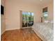 Neutral bedroom with a sliding glass door that leads to a balcony at 2308 W Jetton Ave, Tampa, FL 33629