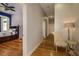 Hallway view showcasing access to a bedroom and decorative chair and table at 2308 W Jetton Ave, Tampa, FL 33629