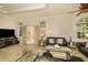 Bright living room with arch windows and a large television set for entertainment at 2308 W Jetton Ave, Tampa, FL 33629