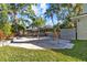 Lush backyard with a swing set at 2309 Valrico Forest Dr, Valrico, FL 33594