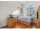 Bright bedroom features a large vaulted window with seating ledge and a standard closet at 2309 Valrico Forest Dr, Valrico, FL 33594