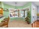 Bright dining area features an amazing view into the screened in pool and back porch area at 2309 Valrico Forest Dr, Valrico, FL 33594