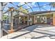 Inviting covered patio offers a relaxed setting with spacious seating and a lush backyard view at 2309 Valrico Forest Dr, Valrico, FL 33594