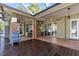 Inviting covered patio boasts tile floors and ceiling fans at 2309 Valrico Forest Dr, Valrico, FL 33594