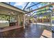 Inviting covered patio boasts an outdoor space with both wood and tile flooring at 2309 Valrico Forest Dr, Valrico, FL 33594