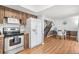 Cozy kitchen with classic appliances, hardwood flooring, and lots of natural light offers a comfortable and functional space at 2646 Barksdale Ct, Clearwater, FL 33761