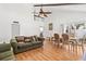 A combined living and dining room, with vaulted ceiling and wood beams is open and inviting at 2646 Barksdale Ct, Clearwater, FL 33761